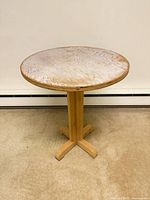 Round pine side table front view