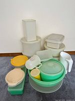All plastic storage containers and serving pieces grouped together