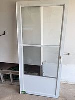 Full view of white aluminum storm/screen door front side