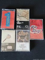 Front view of five Chicago cassette tapes showing album artwork Twenty 1, 17, 19, 16 and 13