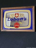 Front view of framed Labatt's carnival glass mirror showing graphics and frame