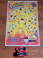 Full view of poster and handheld game