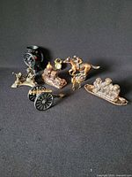 Group shot showing all seven metal ornaments