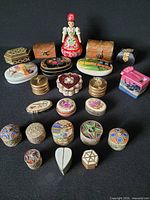 Front view showing full assortment of miniature boxes and painted wooden doll