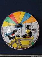 Full view of circular glass light cover showing Looney Tunes graphic