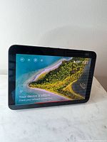 Front view of Amazon Echo Show 8 powered on displaying screen