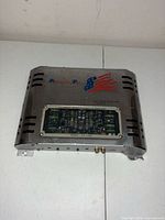 Top view of amplifier showing brand, model window, and cosmetic wear