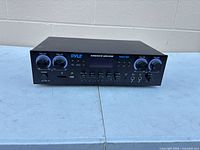 Front view of Pyle PDA77BU amplifier showing controls, USB, SD slots and mic inputs