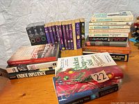 Overall view showing stacks of books on table