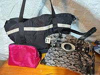 Overview of all three bags upright on table