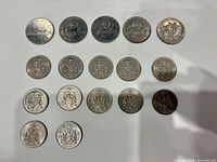 Full lot of 15 Canadian coins laid out in rows