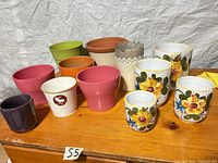 Overall view of 15 assorted pots on table