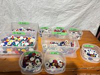 Overview of multiple clear tubs filled with multicolor plastic poker chips