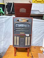 Front full view with lid open showing turntable and overall cabinet
