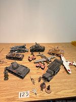 Overall view of lot showing tanks, rocket launcher, artillery, aircraft and figures