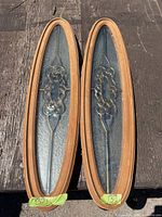 Both oval windows side by side showing full frames and glass design