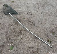 Full view of landing net showing entire length of handle and attached mesh net