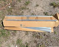 Closed box with several aluminum tracks on top