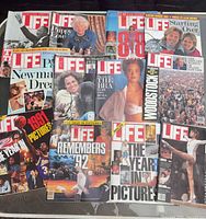 All 12 magazines spread out, showing variety of covers