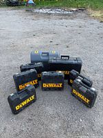 Group shot showing all DeWalt cases and Ryobi case