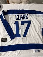 Back view of jersey showing CLARK name, number 17 and signed autograph plus plaque and CCM patch