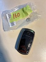 Closed Samsung flip phone rear view with camera lens