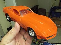 Left front three-quarter view showing body color and wheel detail