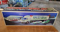 Front graphic panel of boxed 1997 Hess Toy Truck and 2 Racers