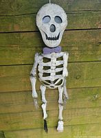 Front view of metal skeleton with bow tie