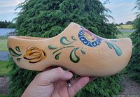Side view showing full clog profile and painted floral detail
