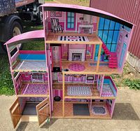 Full frontal view showing all stories and rooms