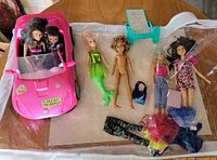 All items laid out: convertible with two dolls, four additional dolls, clothing, accessories