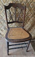 Full front view of the wooden spindle back chair