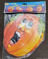 Front view of sealed package showing main pumpkin face and header card