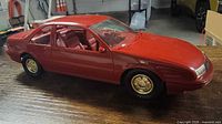 Left front side view of completed red model car