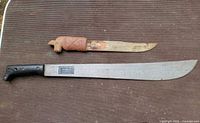 Both machetes side by side showing full length and handle styles