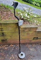 Full view of metal detector showing shaft, control box, armrest and search coil