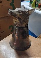 front angled view showing wolf head and bell body