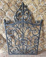 full view of wrought iron panel showing scrollwork and size