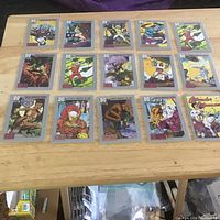 All fifteen 1992 DC Comics trading cards in sleeves on tabletop