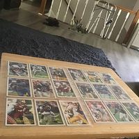 Full lot overview showing all 18 signed football cards in two protective pages
