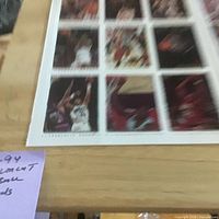 Wide view showing grid layout of uncut card sheet on table