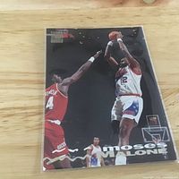 Front of Topps Stadium Club Moses Malone card showing action photo and logo