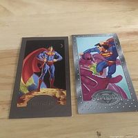 Both Superman Platinum Series cards in full view