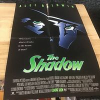 Full view of folded The Shadow poster showing graphics, title and credits