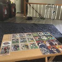 Overall lot on table: GameDay card, uncut sheet, separate signed cards visible