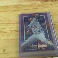 Front view of Hideo Nomo baseball card inside protective holder