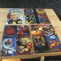 Three uncut Marvel trading card sheets laid on table