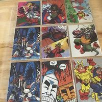 Nine visible comic hero cards in plastic sheet