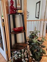 Full view of étagère with accessories and plants